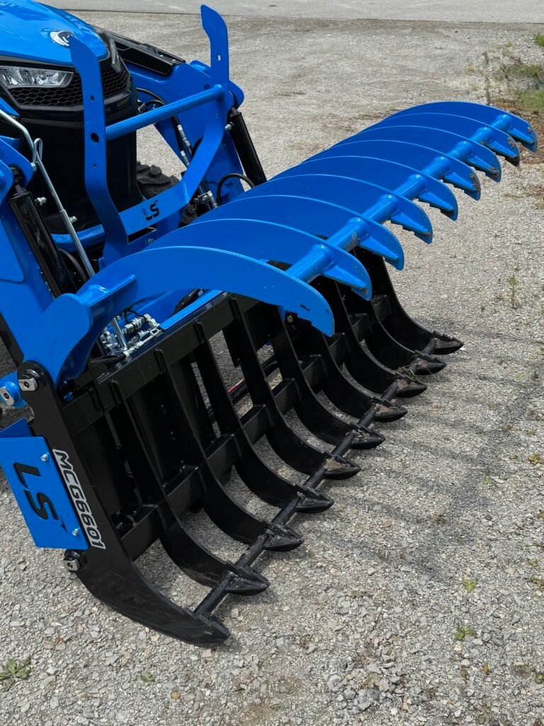 Rake grapple attachment for compact tractor used in brush cleanup and land clearing